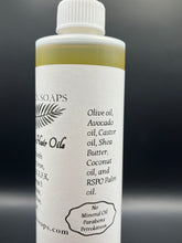 Load image into Gallery viewer, Help give your hair what it needs to be Rejuvenated, Strong, and Grow. Our unique blend of Olive oil, Avocado oil, Castor oil, Shea Butter, Coconut oil, and RSPO Palm oil, are infused with Fenugreek seeds, Basil, Black seeds, Oregano, Rosemary, and Cloves which provide Collogen, Iron, Vitamins A,C,E,F,K, and Omega 3. If you want the hair oil without Rosemary and Cloves, then select the option Without Mint. Comes in an 8oz or 16oz leak proof squeeze bottle with a twist cap.
